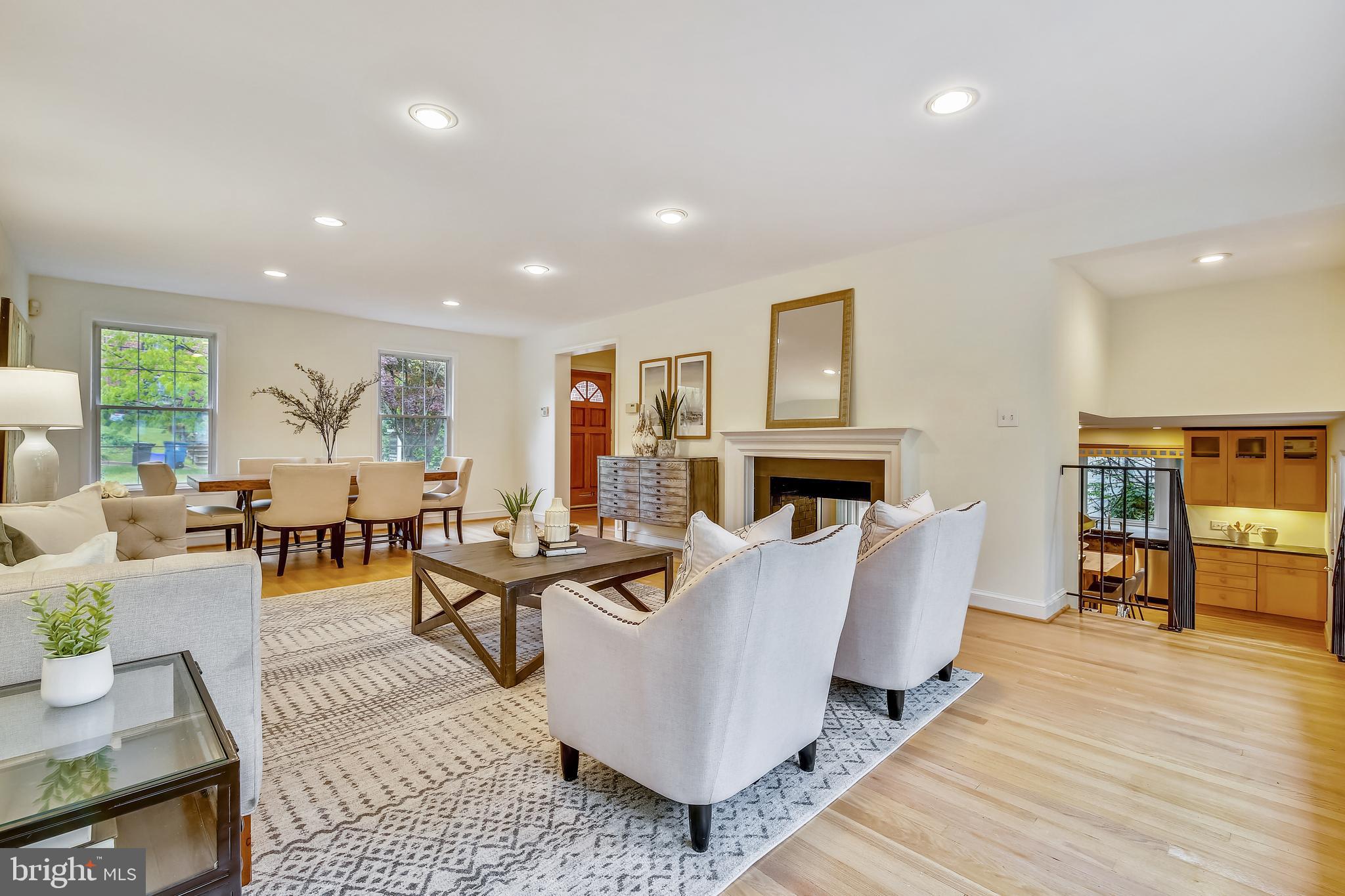 5312 Carvel Road Bethesda, MD 20816 - Photo 2 of 15 Living/dining area with double-sided fireplace