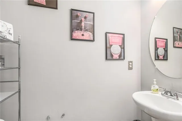 a bathroom with a mirror and a sink