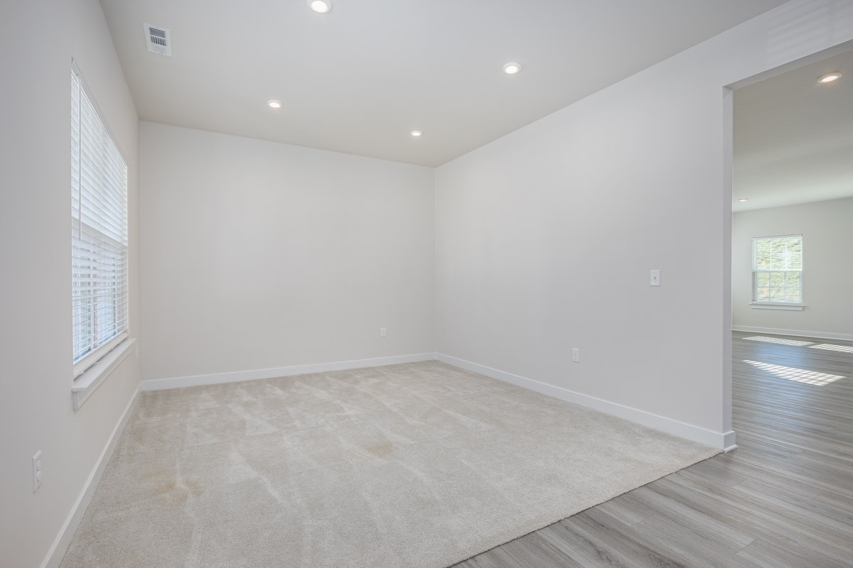 968 Caywood Road Smyrna, TN 37167 - Photo 7 of 54 an empty room with wooden floor and windows