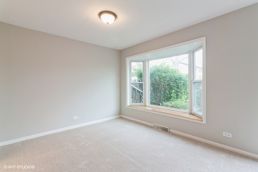 502 Jordan Way Bolingbrook, IL 60440 - Photo 8 of 10 an empty room with windows