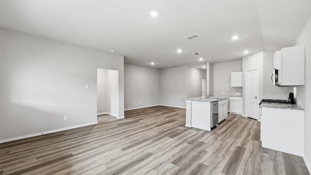 1632 Tin Roof Road Krum, TX 76249 - Photo 13 of 34 a view of kitchen with wooden floor