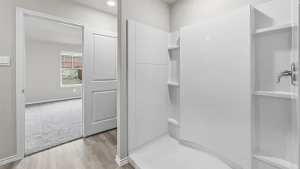 a bathroom with a double vanity sink and mirror