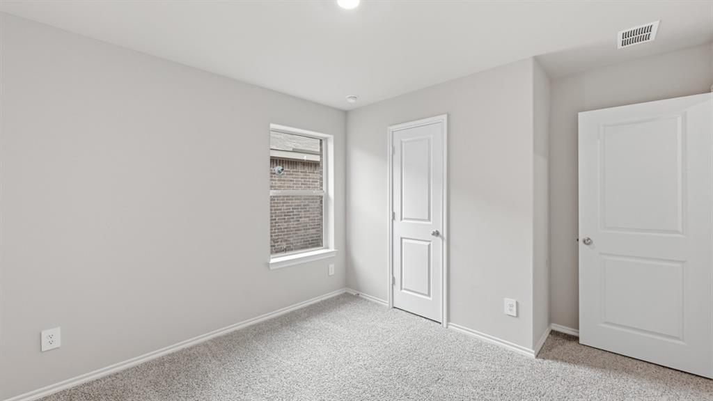 1632 Tin Roof Road Krum, TX 76249 - Photo 27 of 34 an empty room with windows