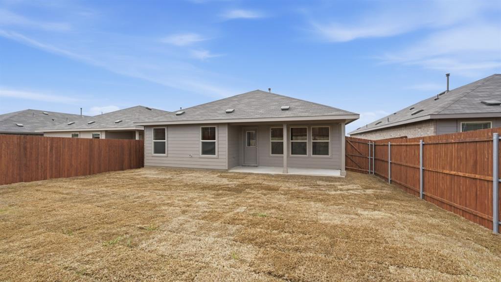 1632 Tin Roof Road Krum, TX 76249 - Photo 30 of 34 a front view of a house with a garden
