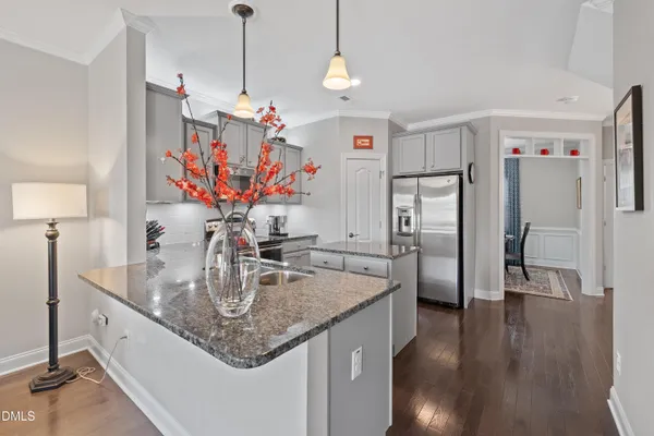 a view of a living room and kitchen