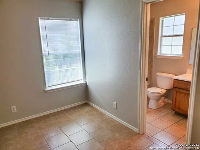1431 Rivas Street San Antonio, TX 78207 - Photo 4 of 9 an empty room with a outdoor space