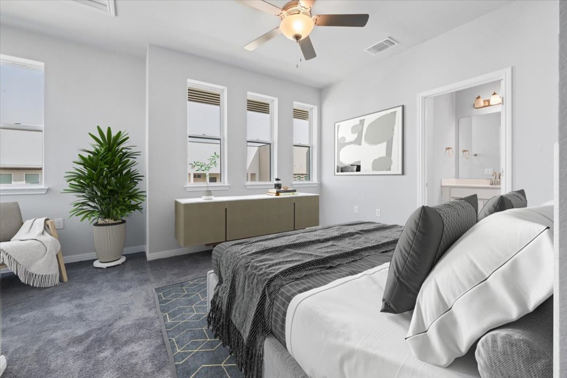 9015 Cattle Baron Path, Unit 1303 Austin, TX 78747 - Photo 13 of 29 a bedroom with a bed and window