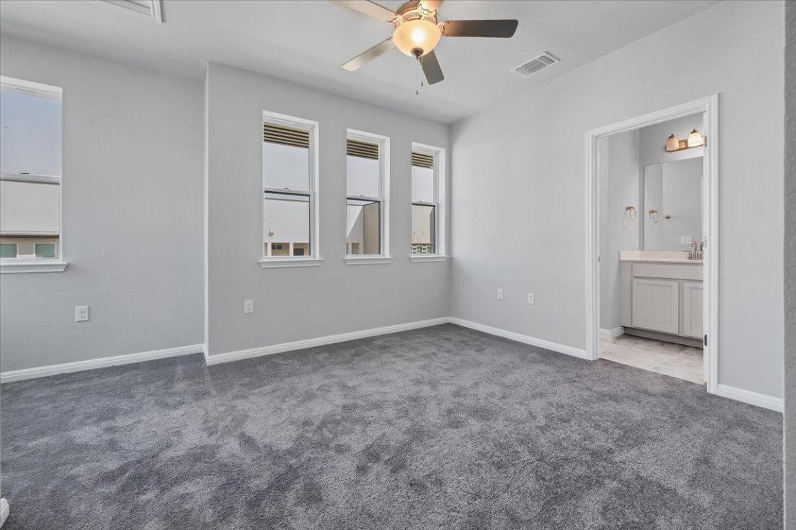 9015 Cattle Baron Path, Unit 1303 Austin, TX 78747 - Photo 14 of 29 a view of an empty room with a window