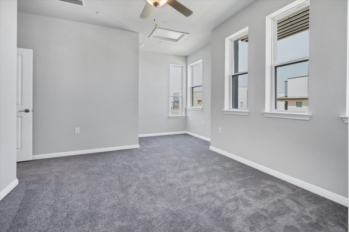 9015 Cattle Baron Path, Unit 1303 Austin, TX 78747 - Photo 16 of 29 a view of an empty room with a window