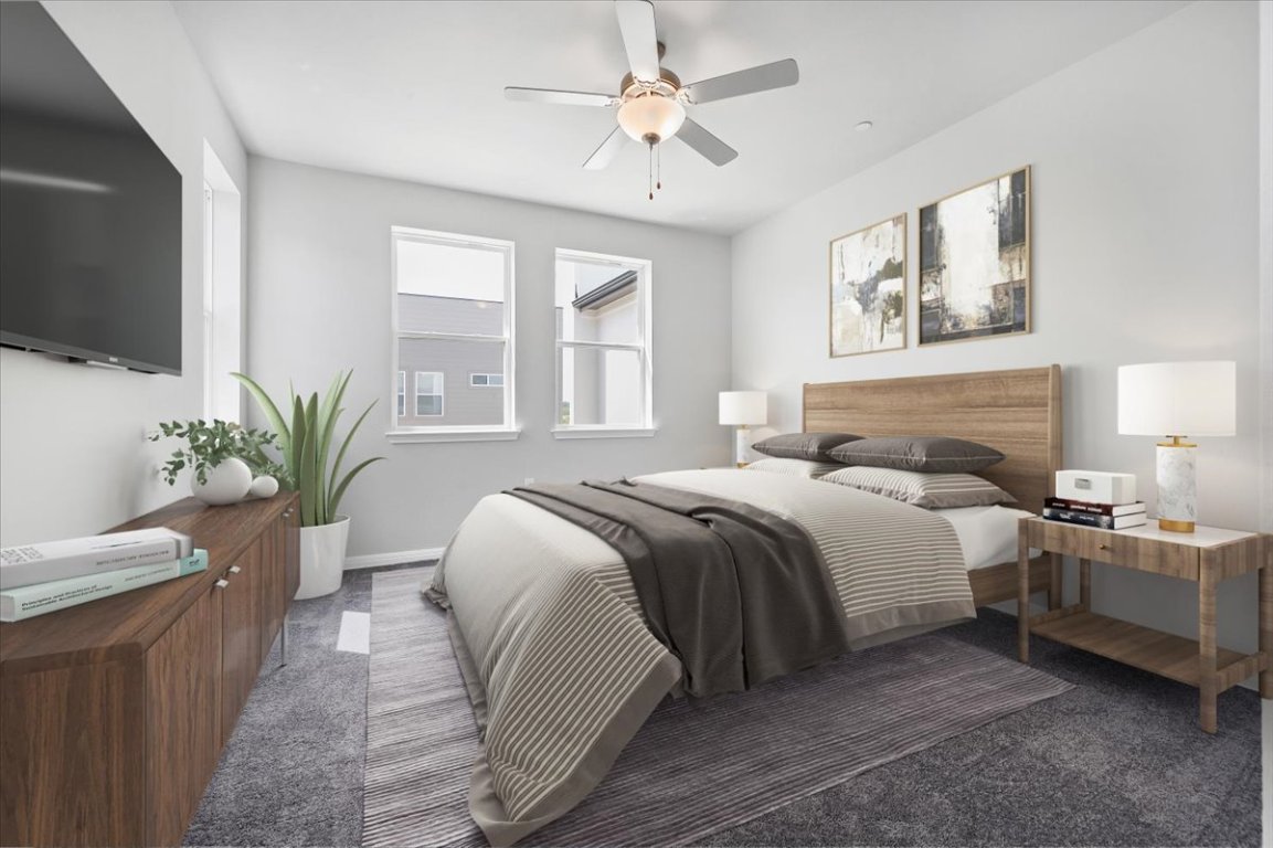 9015 Cattle Baron Path, Unit 1303 Austin, TX 78747 - Photo 20 of 29 a bedroom with a bed and a potted plant