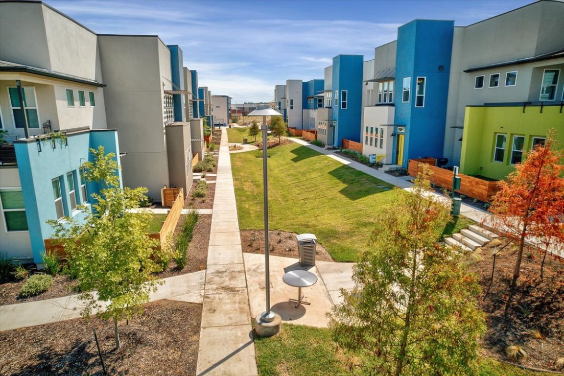 9015 Cattle Baron Path, Unit 1303 Austin, TX 78747 - Photo 29 of 29 a view of an swimming pool with outdoor seating