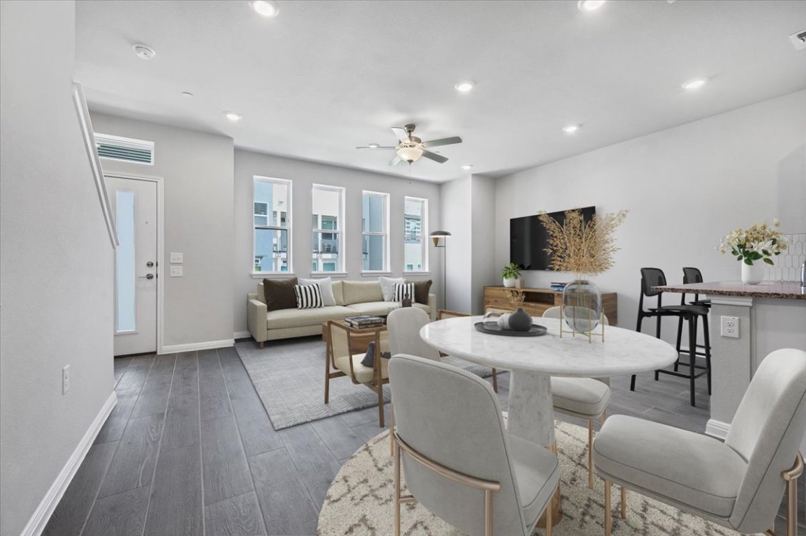 9015 Cattle Baron Path, Unit 1303 Austin, TX 78747 - Photo 4 of 29 a living room with furniture a flat screen tv and a window