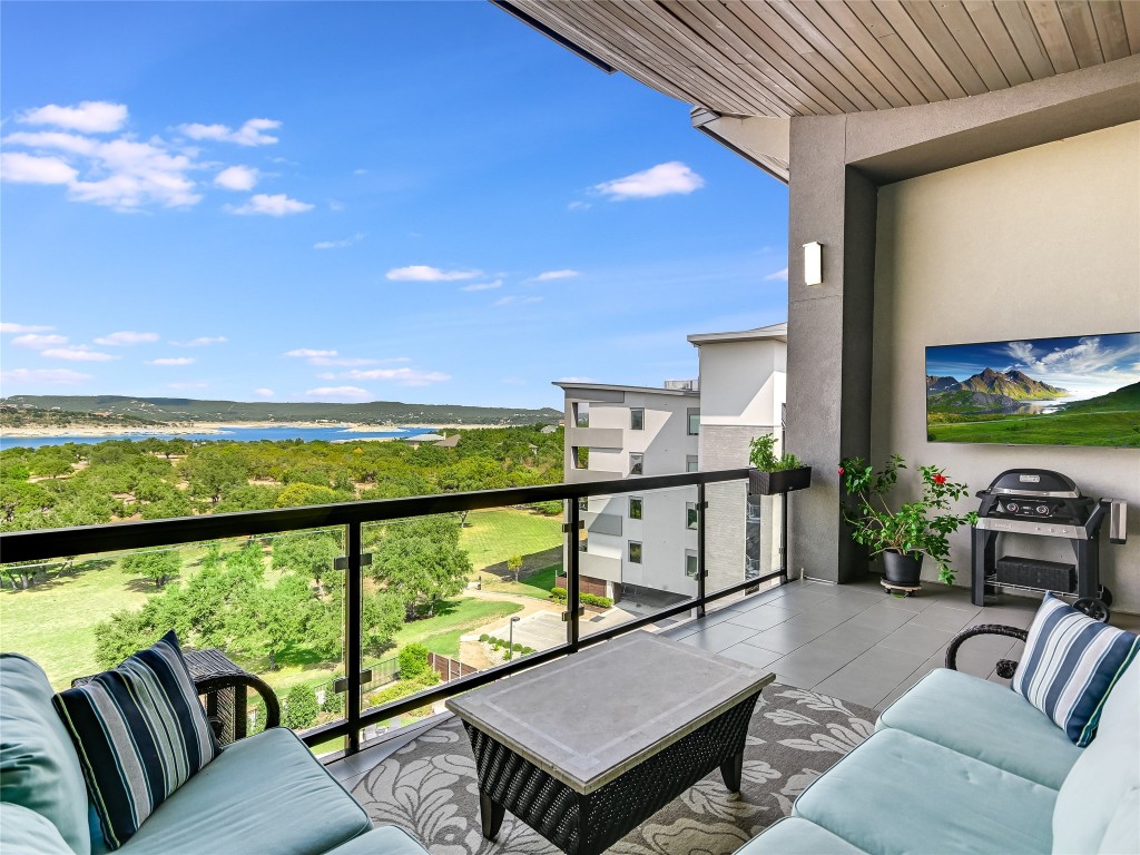 Imagine sipping coffee in the mornings, or wine in the evenings, or sports watching parties. This large covered balcony is the perfect setting for relaxation and entertainment while soaking in panoramic Lake Travis views.