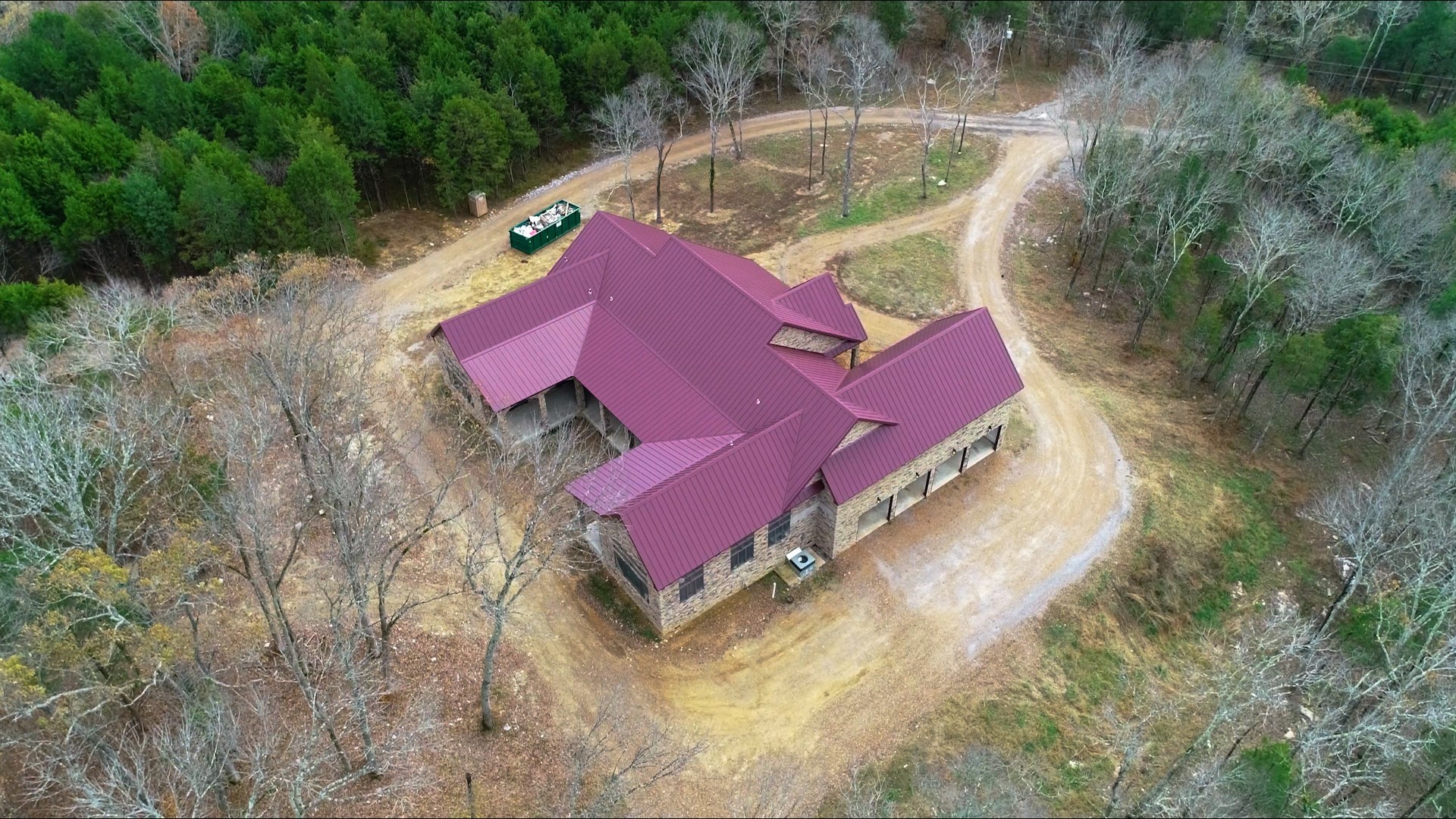 an aerial view of a house with outdoor space