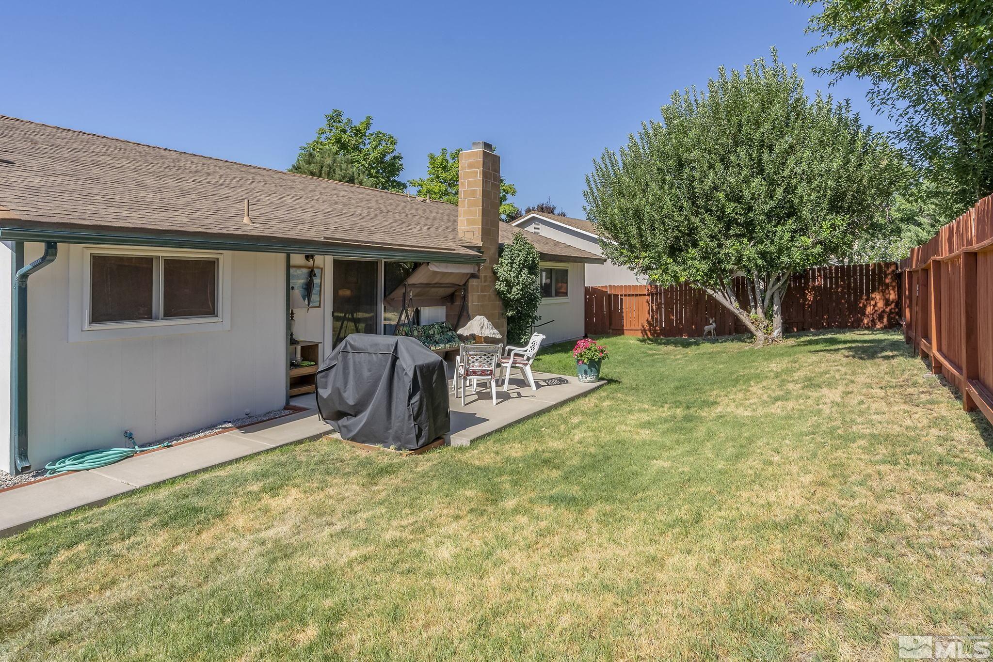 1608 Del Rosa Way Sparks, NV 89434 - Photo 16 of 18 a view of a house with backyard and porch