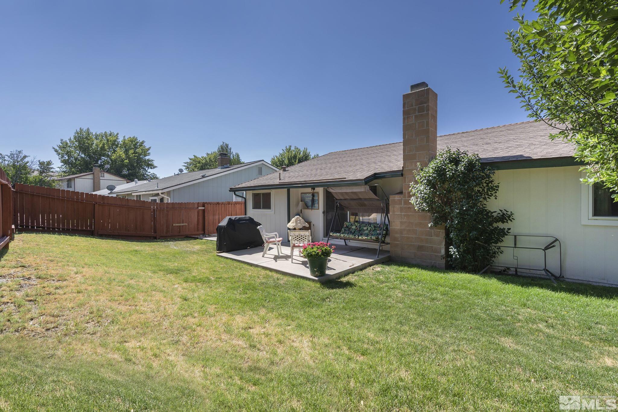 1608 Del Rosa Way Sparks, NV 89434 - Photo 17 of 18 a front view of a house with garden and porch