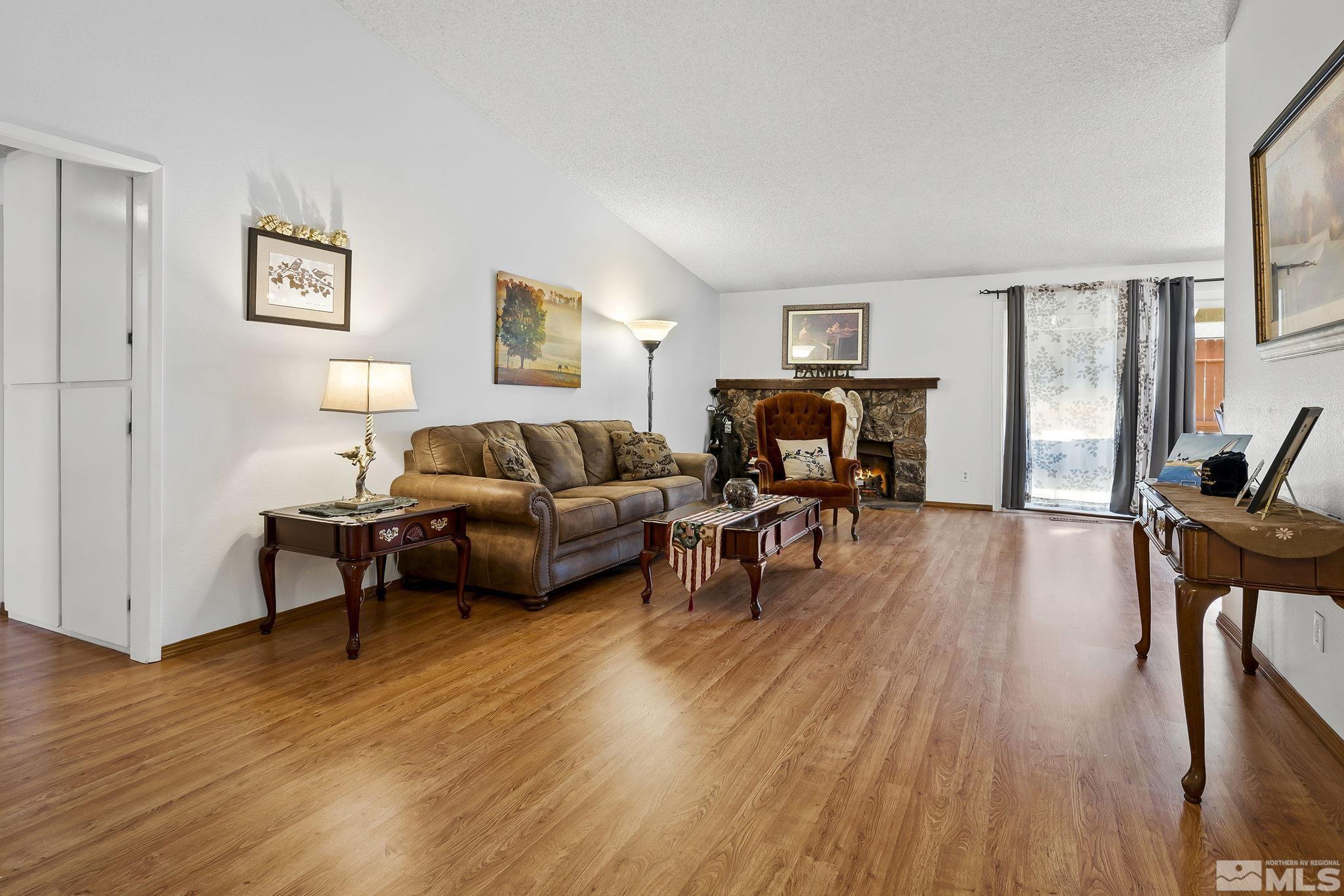 1608 Del Rosa Way Sparks, NV 89434 - Photo 4 of 18 a living room with furniture and a wooden floor