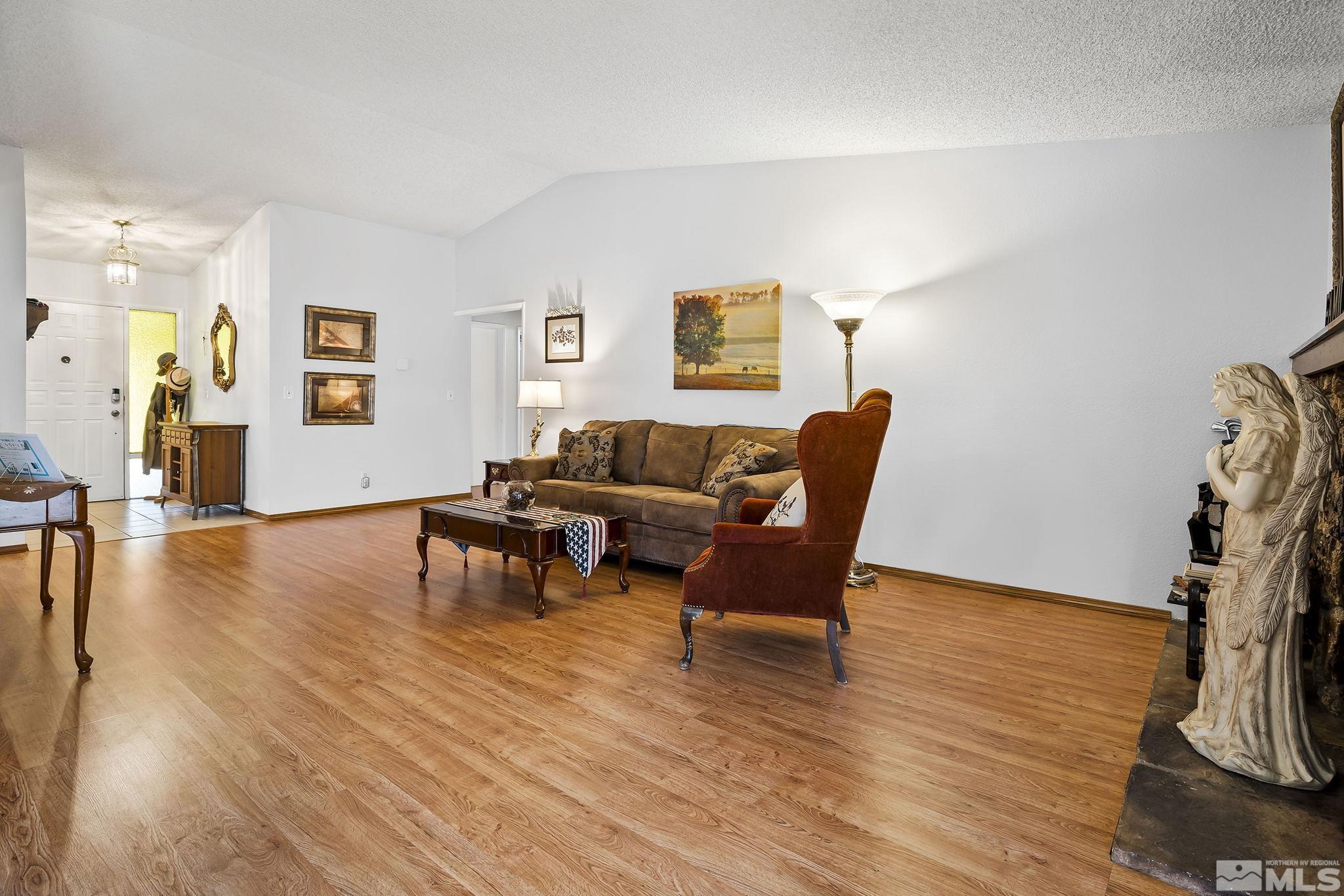 1608 Del Rosa Way Sparks, NV 89434 - Photo 6 of 18 a living room with furniture and a wooden floor