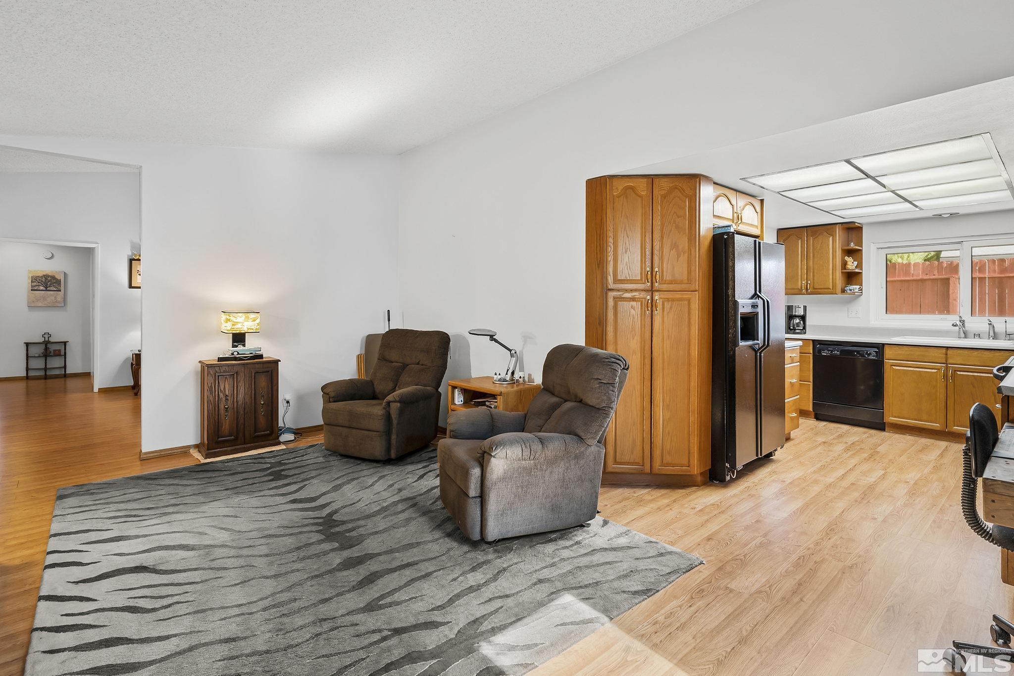 1608 Del Rosa Way Sparks, NV 89434 - Photo 10 of 18 a living room with furniture and a wooden floor