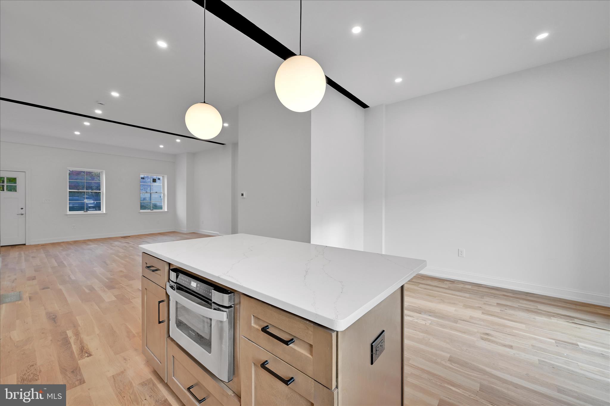 64 East Spring Avenue Ardmore, PA 19003 - Photo 11 of 26 a kitchen that has a microwave and a table