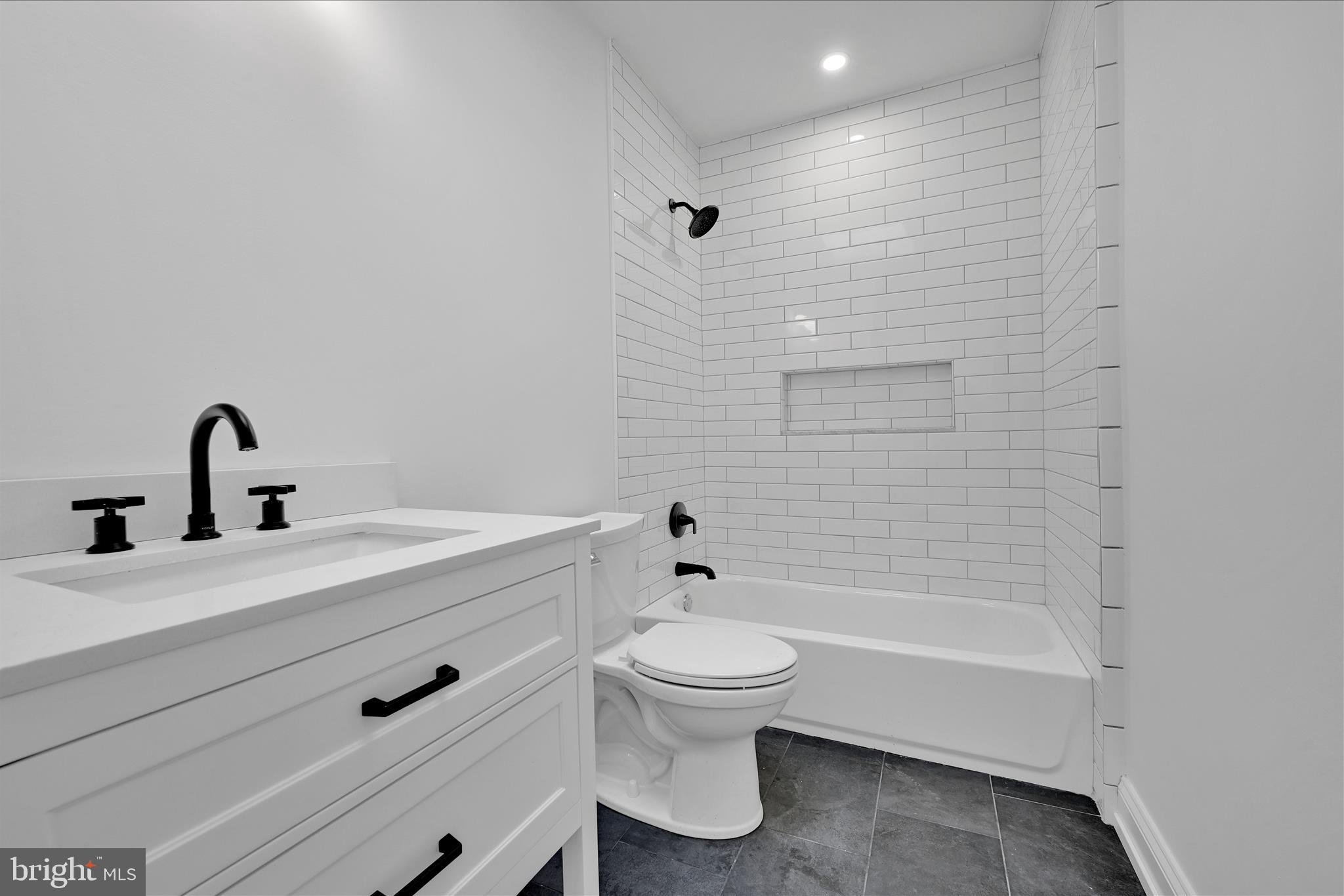 64 East Spring Avenue Ardmore, PA 19003 - Photo 16 of 26 a bathroom with a sink a toilet and shower