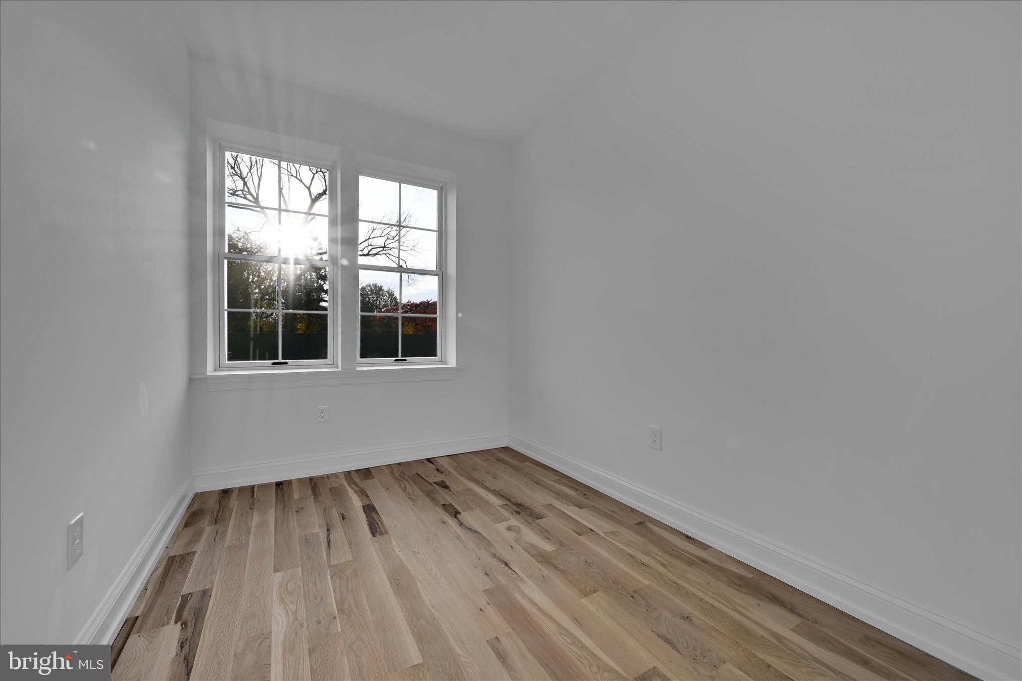 64 East Spring Avenue Ardmore, PA 19003 - Photo 18 of 26 a view of empty room with wooden floor and fan