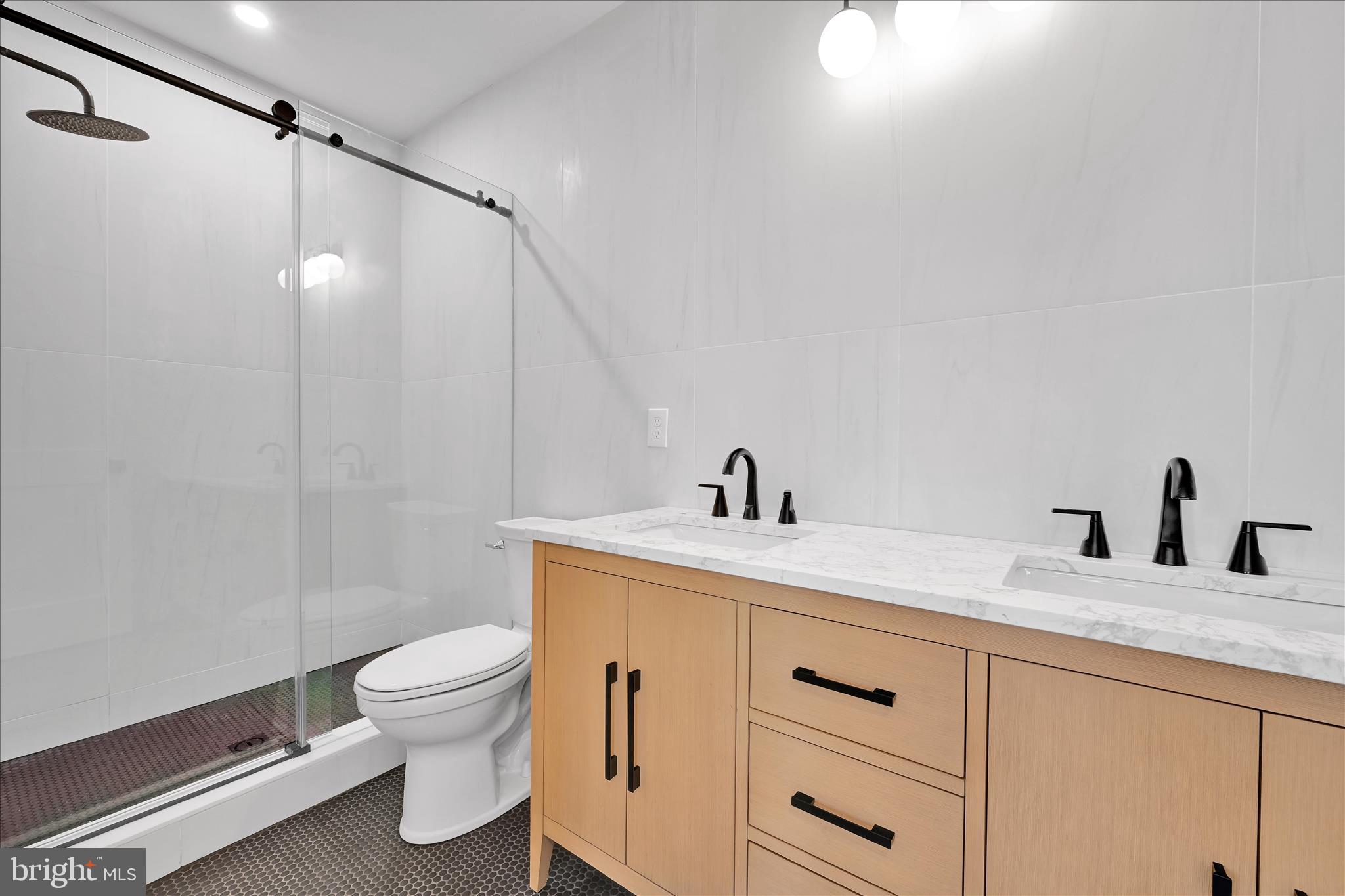 64 East Spring Avenue Ardmore, PA 19003 - Photo 22 of 26 a bathroom with a granite countertop sink vanity mirror and toilet