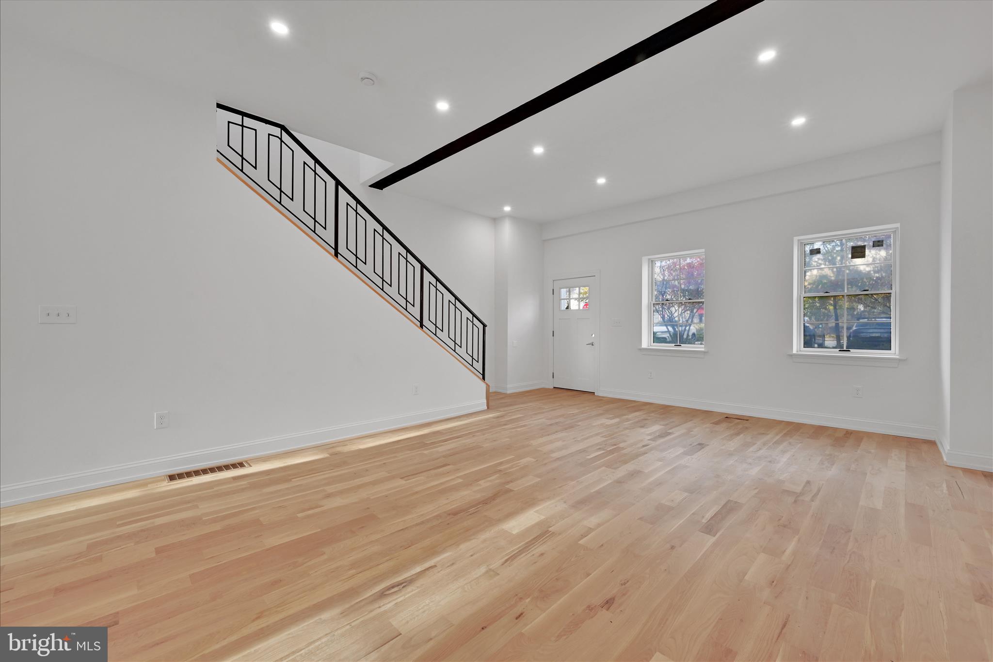 64 East Spring Avenue Ardmore, PA 19003 - Photo 4 of 26 a view of empty room with wooden floor and fan