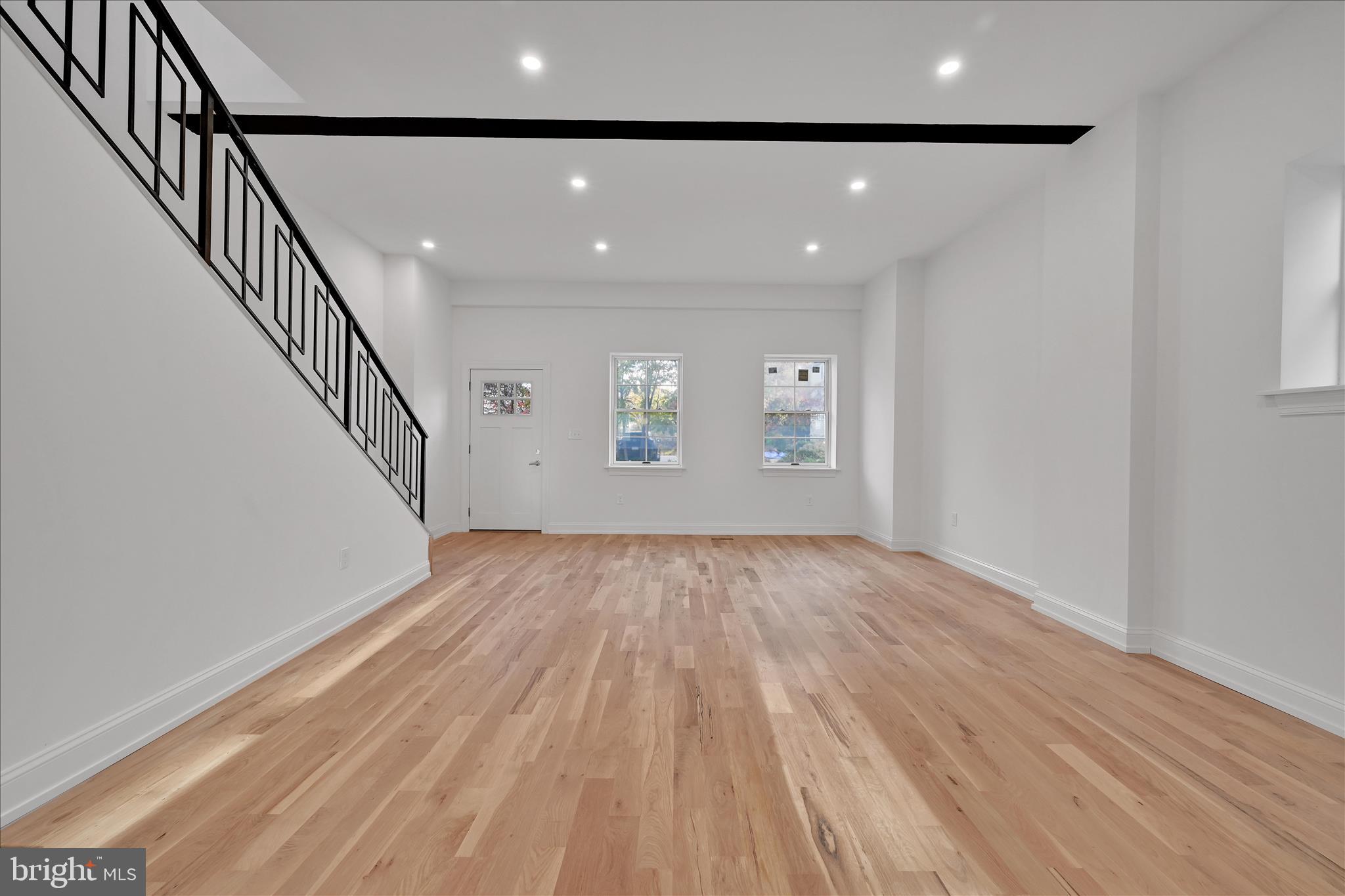 64 East Spring Avenue Ardmore, PA 19003 - Photo 5 of 26 wooden floor in an empty room with a window