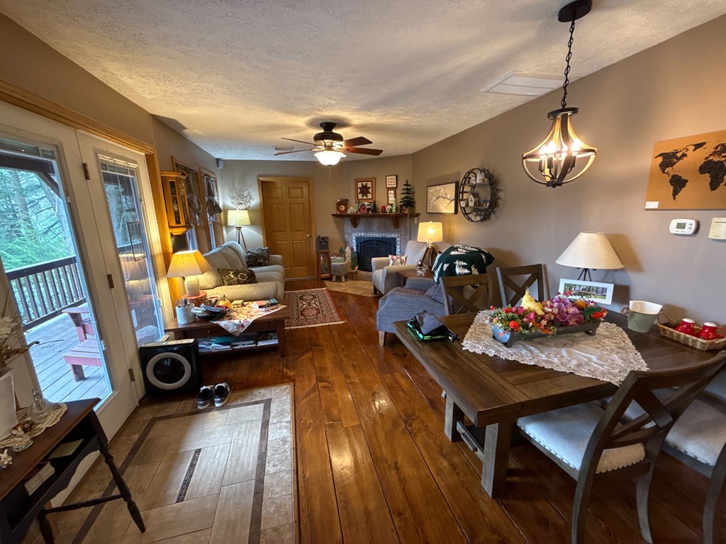 3480 Canoe Ripple Road Sligo, PA 16255 - Photo 16 of 81 a view of a dining room and livingroom with furniture wooden floor a chandelier
