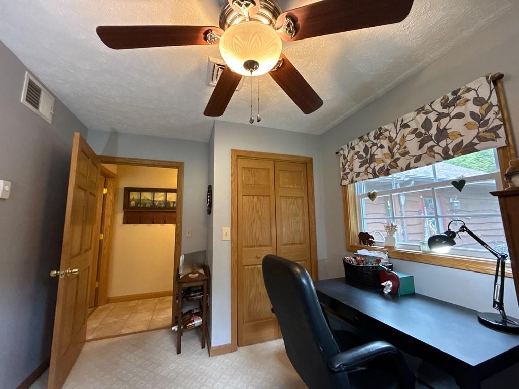 3480 Canoe Ripple Road Sligo, PA 16255 - Photo 43 of 81 a bedroom with a bed and a chandelier
