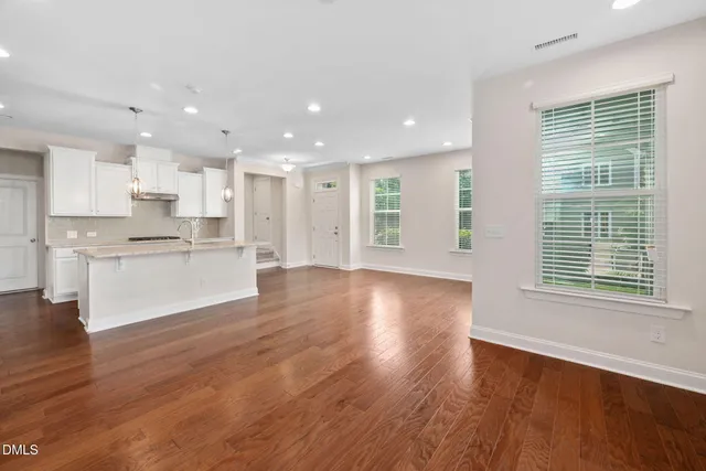 a view of kitchen with wooden floor and window