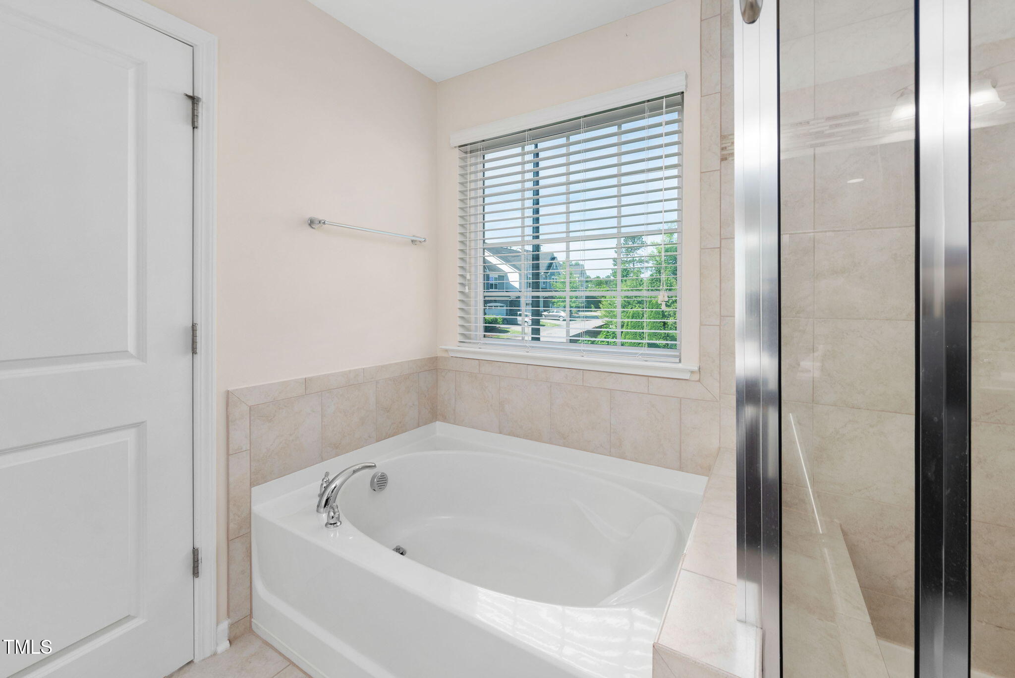 1103 Laurel Twist Road Cary, NC 27513 - Photo 22 of 38 a white bath tub sitting next to a window