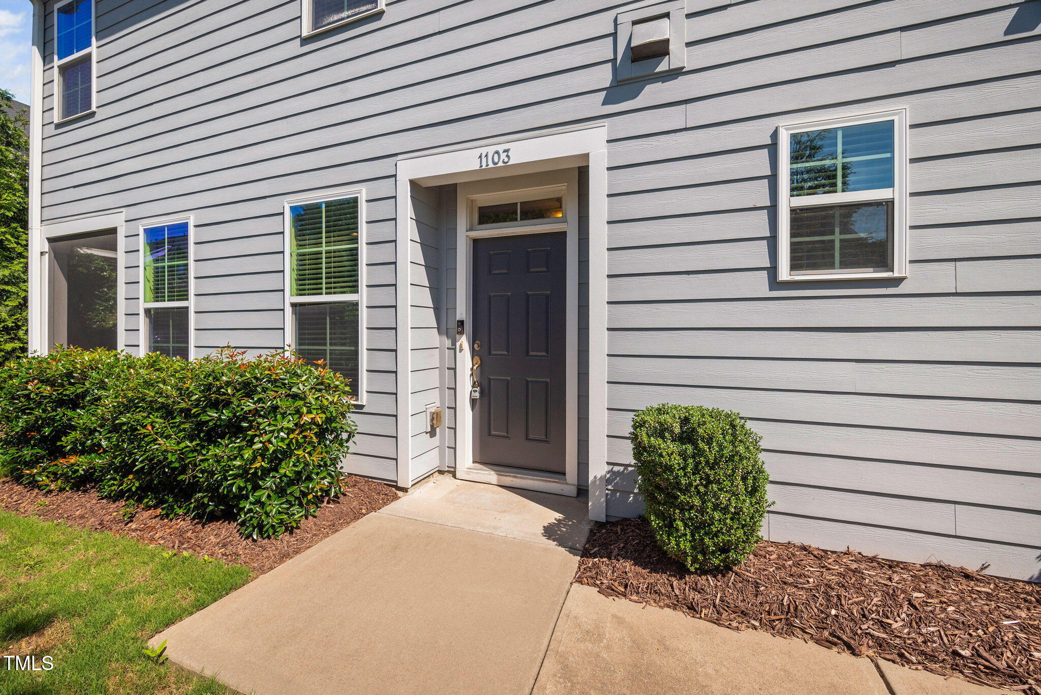 1103 Laurel Twist Road Cary, NC 27513 - Photo 3 of 38 a couple of potted plants in front of door