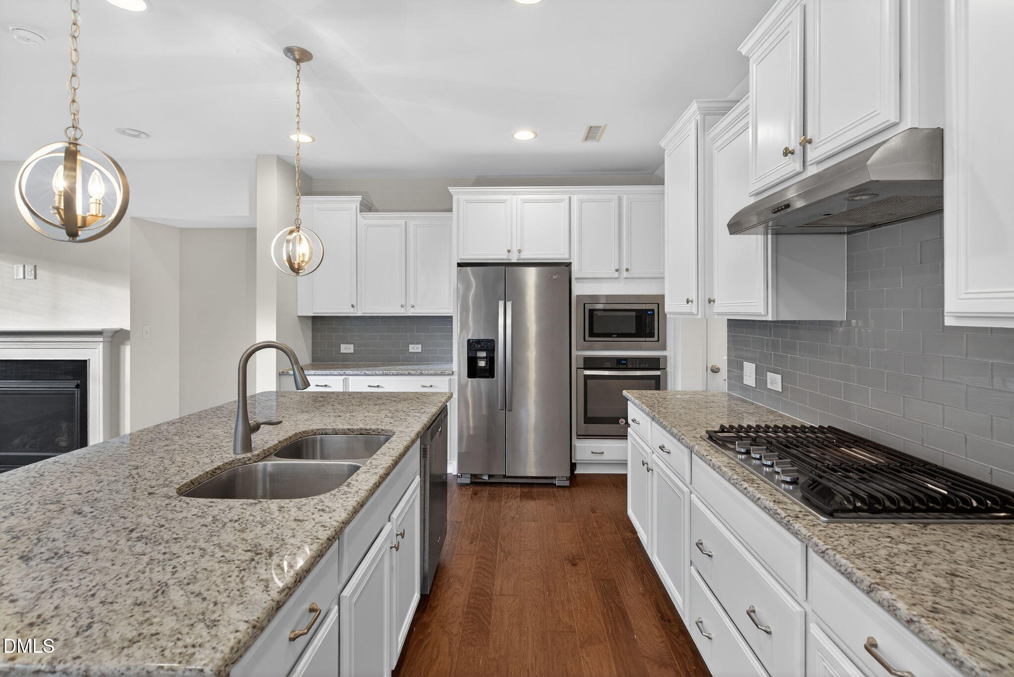 1103 Laurel Twist Road Cary, NC 27513 - Photo 5 of 38 a kitchen with stainless steel appliances granite countertop a sink stove and refrigerator