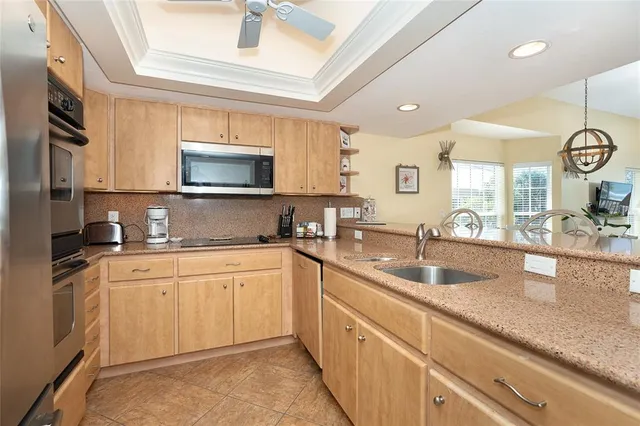 a kitchen with a sink and a refrigerator