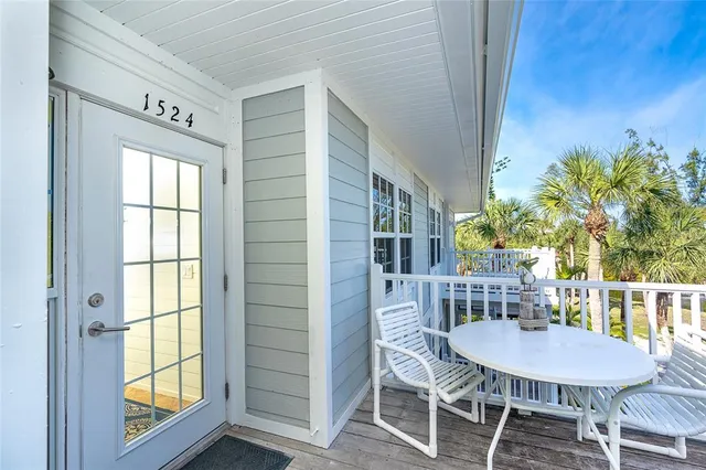 a view of a dining room with furniture and a window