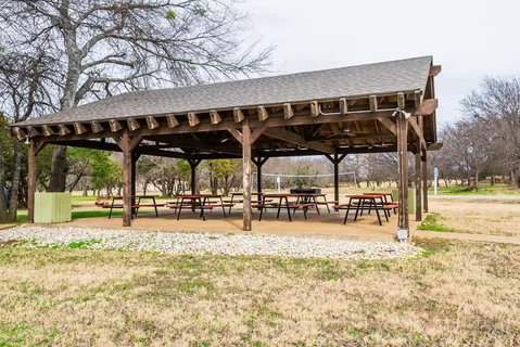 a house view with a garden and outdoor seating