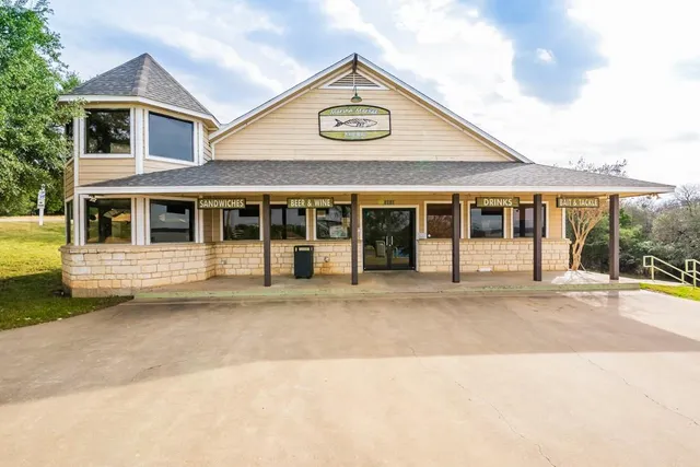 a view of swimming pool with outdoor seating and yard in back