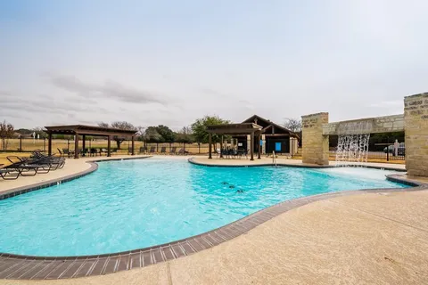 a view of a chairs and tables in patio