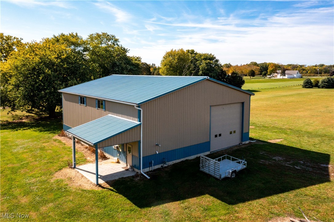 3621 Northeast Catawba Road Port Clinton, OH 43452 - Photo 4 of 18 View of outdoor structure featuring view of scattered trees