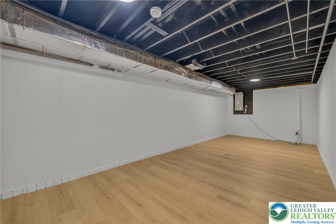 3130 Muirfield Road Center Valley, PA 18034 - Photo 54 of 63 Clean lines and warm plank flooring define this versatile lower level area.
