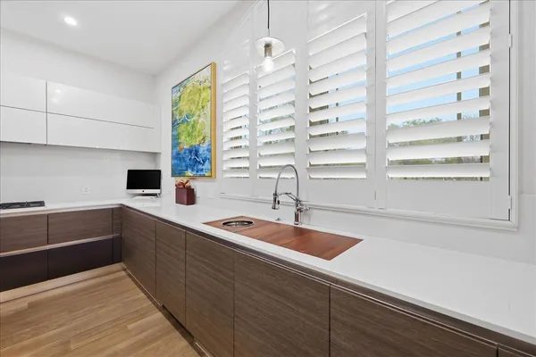 a kitchen with a sink and a window