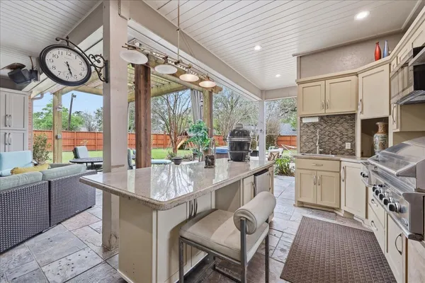 a kitchen with stainless steel appliances granite countertop a stove and a sink