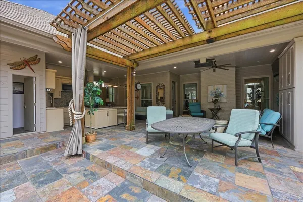 a view of a patio with table and chairs