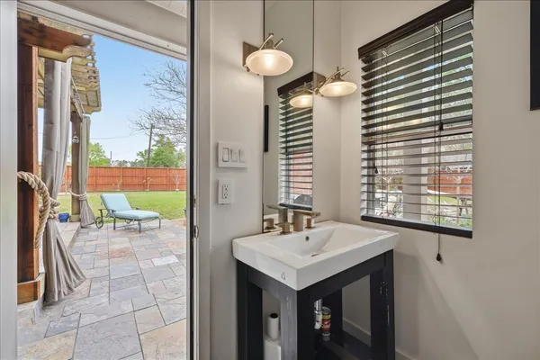 a bathroom with a sink and a mirror