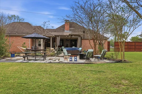 a front view of house with yard and seating area