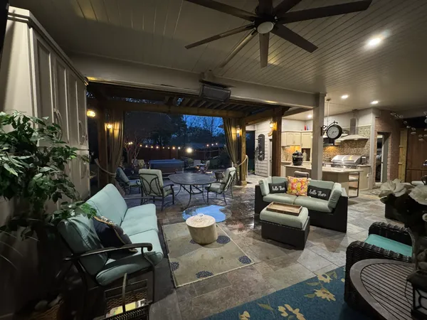 a living room with lots of furniture and white walls