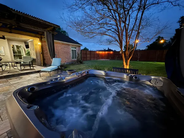 a view of backyard with outdoor seating