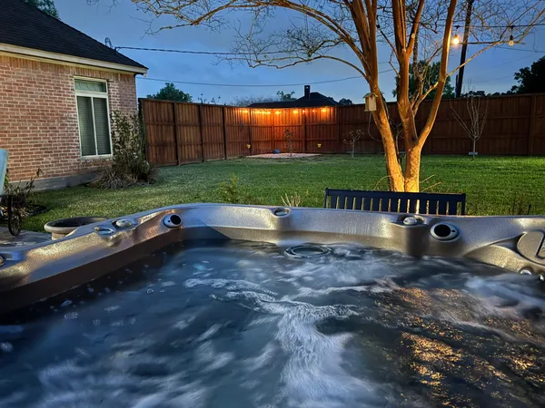 a view of backyard with outdoor seating